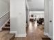 Inviting entryway with hardwood floors flowing into the living and kitchen areas, plus carpeted stairs at 237 River Clay Rd, Fort Mill, SC 29708