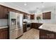 Contemporary kitchen featuring stainless steel appliances, granite counters, and a bright window at 237 River Clay Rd, Fort Mill, SC 29708