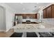 Modern kitchen with granite countertops, a stainless-steel refrigerator, and ample cabinet space at 237 River Clay Rd, Fort Mill, SC 29708