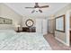Bright main bedroom features a ceiling fan, carpet, and an elegant dresser for ample storage at 237 River Clay Rd, Fort Mill, SC 29708