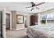 Bright main bedroom features a ceiling fan, carpet, and an elegant wardrobe for ample storage at 237 River Clay Rd, Fort Mill, SC 29708