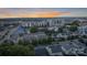 An aerial view of a neighborhood with multiple buildings and rooftops at sunset at 2514 Marshall Pl, Charlotte, NC 28203