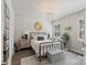 A bedroom with a metal bed frame, a decorative chandelier and lots of natural light coming through the windows at 2514 Marshall Pl, Charlotte, NC 28203