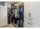 A spacious closet filled with clothing, custom shelving and cabinets for optimal organization at 2514 Marshall Pl, Charlotte, NC 28203