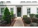 Inviting home exterior featuring a well-manicured walkway and lush landscaping leading to a charming green front door at 2514 Marshall Pl, Charlotte, NC 28203