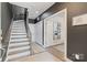 Hallway with dark walls, and light floors and stairs leading into a bedroom at the end of the hall at 2514 Marshall Pl, Charlotte, NC 28203
