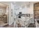 Modern kitchen with marble countertops, white cabinets and eat-in island with barstool seating at 2514 Marshall Pl, Charlotte, NC 28203