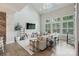 Sunlit living room showcasing vaulted ceilings, a wall of windows and stylish, neutral decor at 2514 Marshall Pl, Charlotte, NC 28203