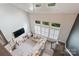 Bright living room with a high ceiling, large windows, a comfortable sectional sofa, and modern decor at 2514 Marshall Pl, Charlotte, NC 28203