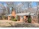 Front exterior view of the single story red brick house and yard at 3515 Back Creek Church Rd, Charlotte, NC 28213