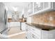 Spacious kitchen featuring white cabinetry, granite countertops, and stainless steel refrigerator at 3515 Back Creek Church Rd, Charlotte, NC 28213