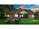 Charming brick home features a spacious backyard with a screened-in porch and wooden deck at 3831 Riceland Pl, Charlotte, NC 28216