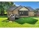 Well-maintained backyard includes a deck and screened-in patio, perfect for outdoor enjoyment at 3831 Riceland Pl, Charlotte, NC 28216