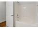 Bathroom featuring a shower and tub combination with neutral walls at 3831 Riceland Pl, Charlotte, NC 28216