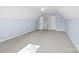 Bright bonus room with neutral carpet and light blue walls at 3831 Riceland Pl, Charlotte, NC 28216