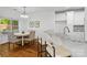 Dining area with bar seating and window views at 3831 Riceland Pl, Charlotte, NC 28216