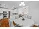 Open dining area with white cabinets and view of the living room at 3831 Riceland Pl, Charlotte, NC 28216