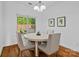 Bright dining area featuring a round table with seating for four at 3831 Riceland Pl, Charlotte, NC 28216
