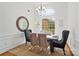 Sunlit dining room with elegant chandelier and stylish decor at 3831 Riceland Pl, Charlotte, NC 28216