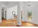 Elegant foyer with hardwood floors, decorative door, and detailed trim work at 3831 Riceland Pl, Charlotte, NC 28216