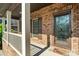 Inviting front porch with brick facade, decorative door, and welcome mat at 3831 Riceland Pl, Charlotte, NC 28216