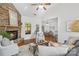 Cozy living room with stone fireplace, hardwood floors, and open layout at 3831 Riceland Pl, Charlotte, NC 28216