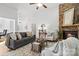 Inviting living room featuring a stone fireplace, hardwood floors, and comfortable seating at 3831 Riceland Pl, Charlotte, NC 28216