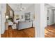 Bright living room with stone fireplace, hardwood floors, and open floor plan at 3831 Riceland Pl, Charlotte, NC 28216