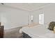 Spacious main bedroom featuring neutral tones, tray ceiling, and an ensuite bathroom at 3831 Riceland Pl, Charlotte, NC 28216