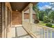Covered porch offering a view of the front yard and a brick house facade at 3831 Riceland Pl, Charlotte, NC 28216