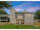 Stunning back exterior of home with a well-manicured lawn and privacy fence at 408 Ideal Way, Charlotte, NC 28203