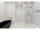 Elegant bathroom featuring a freestanding tub and glass-enclosed shower with marble tile at 408 Ideal Way, Charlotte, NC 28203