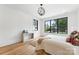 Stylish bedroom featuring a large window, modern light fixture, and neutral decor for a calming and sophisticated space at 408 Ideal Way, Charlotte, NC 28203
