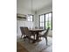 Elegant dining room with a wooden table, comfortable chairs, and a view of the neighborhood at 408 Ideal Way, Charlotte, NC 28203