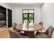 Bright dining room with wood floors, a round table, and large windows, perfect for entertaining and everyday meals at 408 Ideal Way, Charlotte, NC 28203
