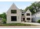 Charming two-story home with elegant white brick, black windows, and landscaped front yard at 408 Ideal Way, Charlotte, NC 28203