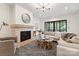 Relaxing living room featuring a cozy fireplace, plush sofa, stylish coffee table, and recessed lighting at 408 Ideal Way, Charlotte, NC 28203