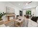Spacious living room with wood floors, a modern sofa, and ample natural light, creating a comfortable and inviting space at 408 Ideal Way, Charlotte, NC 28203