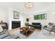 Bright living room featuring a cozy fireplace, and large windows at 408 Ideal Way, Charlotte, NC 28203