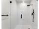 Walk-in shower featuring a glass door, modern fixtures and white subway tile at 408 Ideal Way, Charlotte, NC 28203
