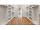 Spacious walk-in closet with custom shelving and wood floors at 408 Ideal Way, Charlotte, NC 28203
