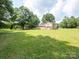 Large backyard with detached garage and ample green space at 409 Ridge Rd, Clover, SC 29710