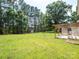Expansive backyard with a storage shed and covered patio at 409 Ridge Rd, Clover, SC 29710