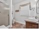 Clean bathroom with a shower, vanity, and window, offering a functional space at 409 Ridge Rd, Clover, SC 29710