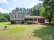 Charming two-story home featuring a welcoming front porch and beautifully landscaped front yard at 409 Ridge Rd, Clover, SC 29710