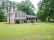 Well-maintained two-story home with a brick chimney and inviting front porch at 409 Ridge Rd, Clover, SC 29710