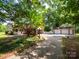 Charming home with a well-manicured front yard, a large garage, and ample parking space at 409 Ridge Rd, Clover, SC 29710