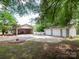 Large detached garage with multiple bays and spacious driveway, perfect for car enthusiasts or hobbyists at 409 Ridge Rd, Clover, SC 29710