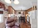 Charming eat-in kitchen with wood cabinets, white appliances, and a cozy breakfast nook at 409 Ridge Rd, Clover, SC 29710