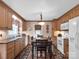 Well-lit eat-in kitchen featuring wood cabinets, black countertops and stainless-steel appliances at 409 Ridge Rd, Clover, SC 29710